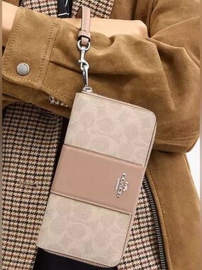Coach Long Zip Around Wallet
In Signature Canvas With Stripe